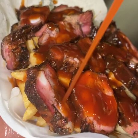 Sauced rib tips over fries